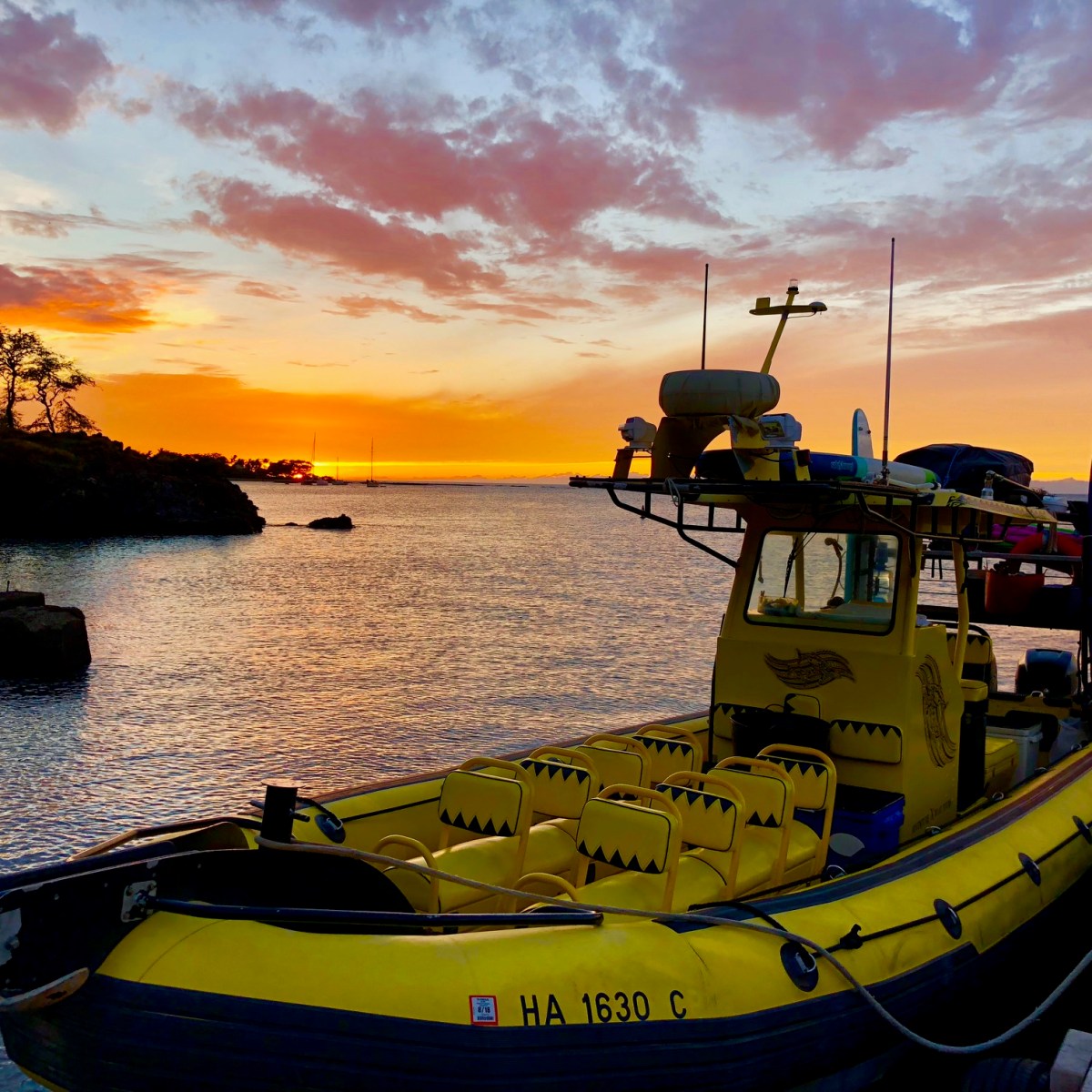 a boat is docked next to a body of water