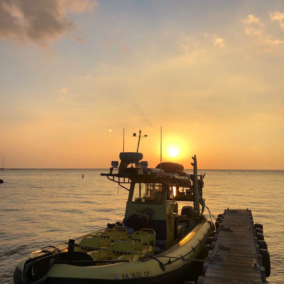 a boat is docked next to a body of water