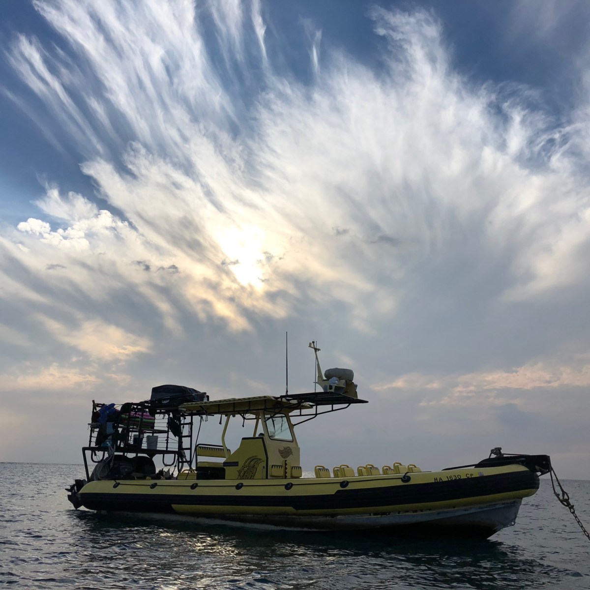 a small boat in a large body of water